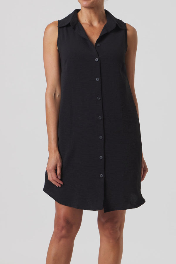 Black sleeveless dress worn by a person on a white background