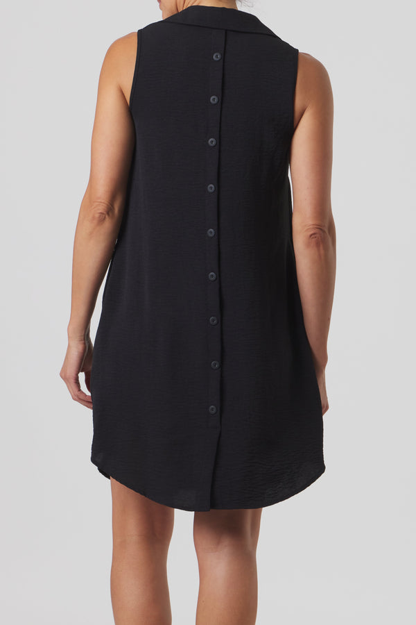 Black sleeveless dress worn by a person on a white background